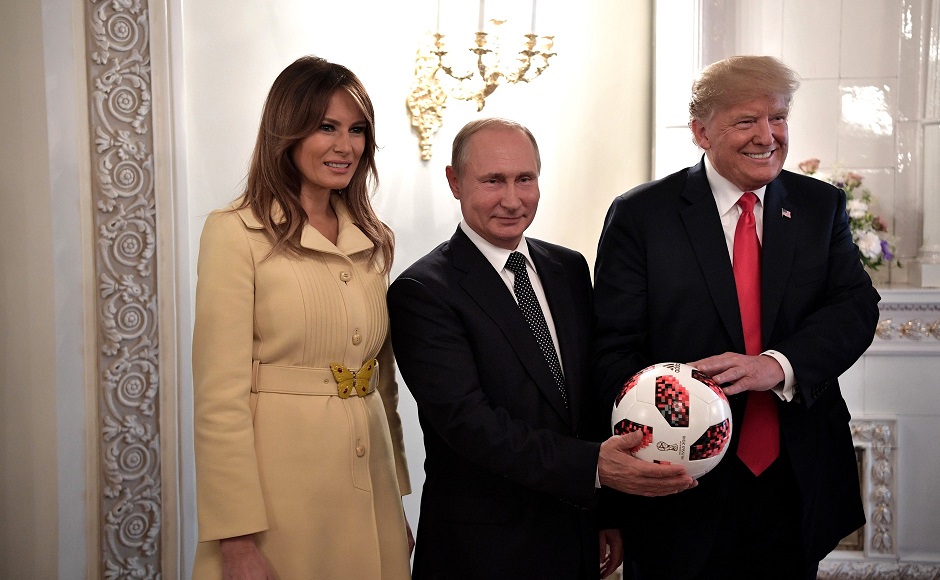 Putin and the Trump couple pose with a soccer ball Putin gave Donald Trump earlier following their one-on-one (with translators only) meeting in Helsinki, Finland on July 16, 2018 (Image: kremlin.ru)