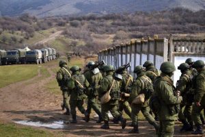 Russian soldiers without identifying military insignia (the so-called "green men") seizing Crimea. Source: Wikipedia