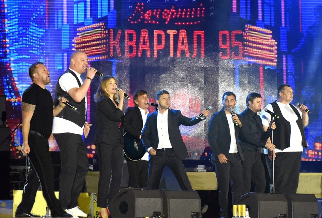 Volodymyr Zelenskyi (center) performing on stage with his comedy group KVARTAL 95 in August 2018 (Photo: Vadym Chupryna / Wikipedia)