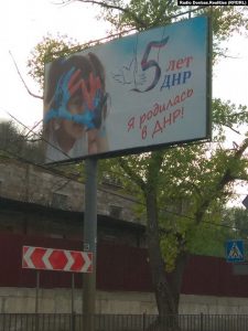 Billboard in occupied Donetsk. “I was born in the DPR!” ~
