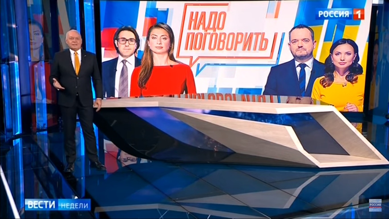 Russian top propagandist Dmitry Kiselyov announces a Ukraine-Russia teleconference to be co-hosted by Russia's Rossiya-1 and Ukraine's NewsOne TV channels. Screenshot: Youtube/Rossiya-24