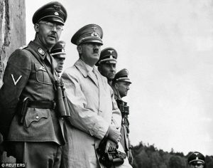 Heinrich Himmler (far left) and Adolf Hitler (second from left) during camp inspection. Photo: German Federal Archives/Reuters ~