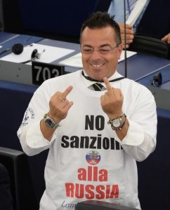 MEP Gianluca Buonanno in EU Parliament protesting against sanctions on Russia for invading Ukraine, 2015. Photo via 112 Channel ~