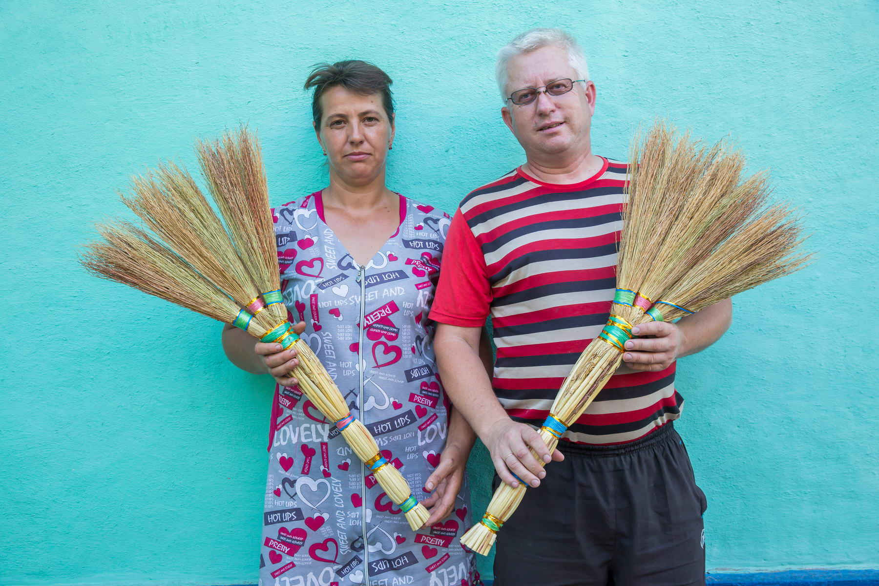 Vasyl and Tetiana with their brooms ~