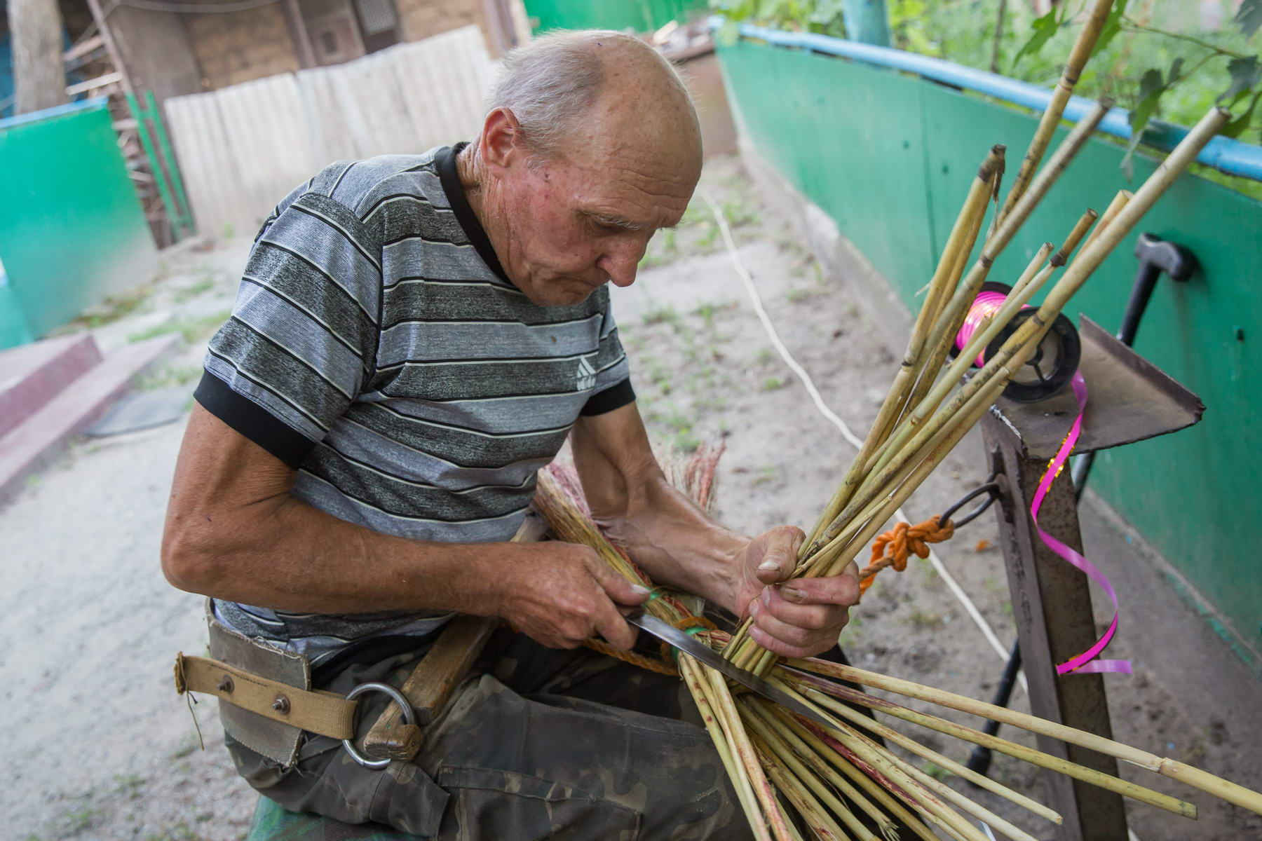 Mykola Shpytko weawing a broom ~