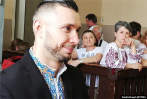 Oksana Maksymchuk watching her son, Pavia courtroom, June 21, 2019. Photo: Natalia Kudryk (RFE/RL) ~