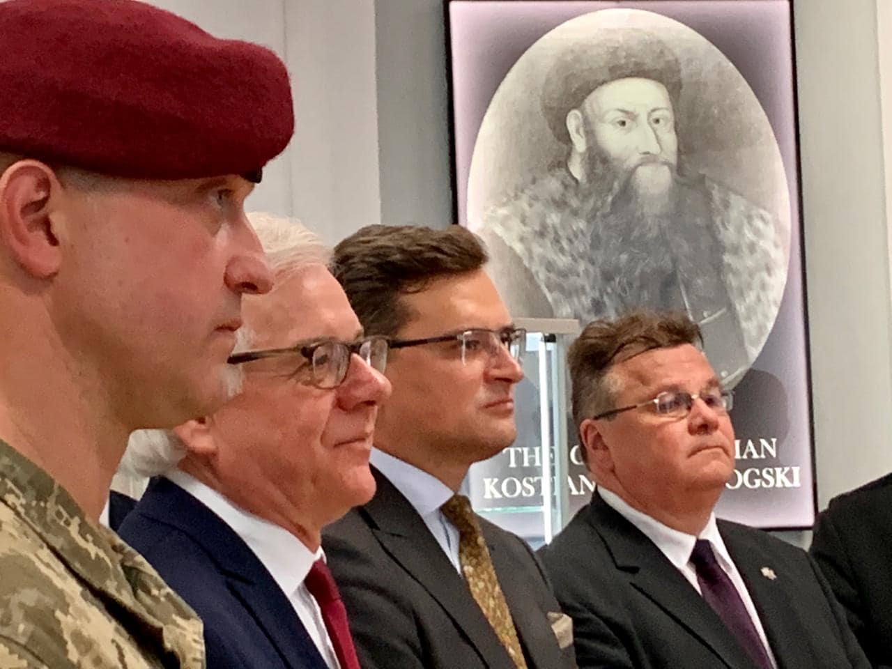 From left to right: Dmytro Bratishko, commander of the LitPolUkr brigade, Ministers of Foreign Affairs of Poland, Ukraine, and Lithuania Jacek Czaputowicz, Dmytro Kuleba, and Linas Linkevičius. In the background is a portrait of Kostiantyn Ostrozhskyi. Source: Dmytro Kuleba’s FB page ~