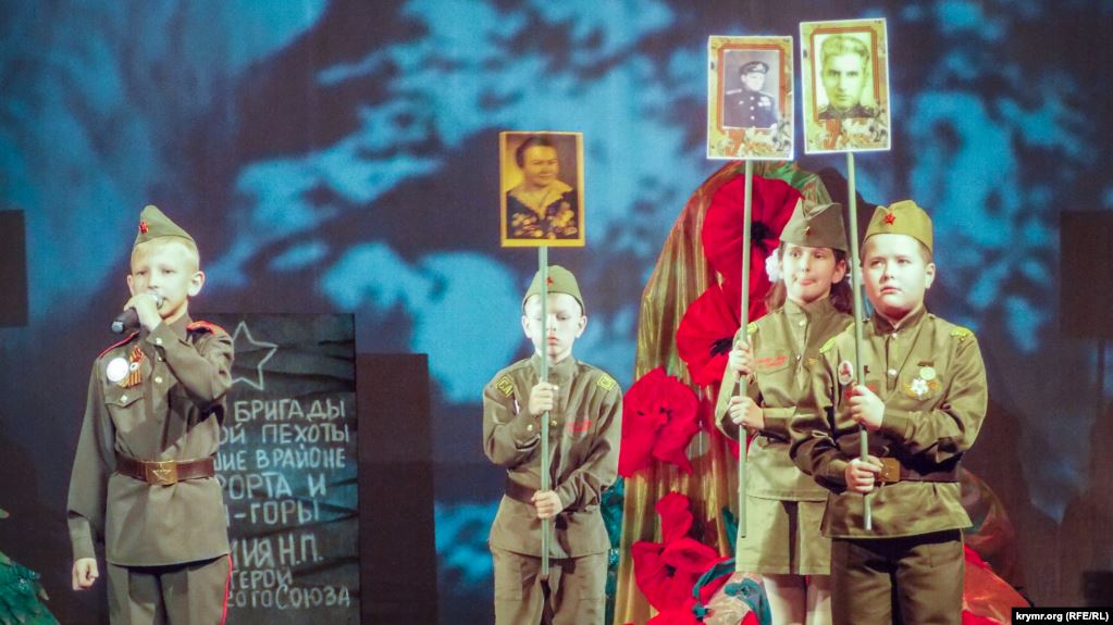 Children performing in an official Victory Day ceremony, “We Are the Heirs of the Victory,” organized by the occupation administration in Sevastopol in Russian-occupied Crimea, April 19, 2020. Photo: Krymr.org (RFE/RL)