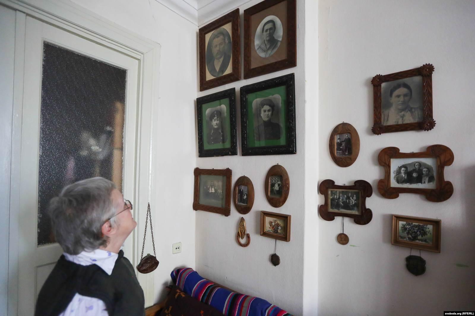 Nina Baginskaya in her house in front of her parent’s photos. Source: svaboda.org/RFE/RL ~