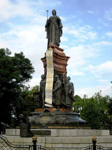 Monument to Russian Empress Catherine II in Krasnodar. It was inaugurated in 1907, destroyed by the Bolsheviks in 1920, and rebuilt in 2006. On the left side – the figure of Russian Prince Grigory Potemkin; on the right side – the first three otamans of the Black Sea Cossack Army; on the back side – a blind kobzar (itinerant Ukrainian bard) with his young guide. Photo: Wikipedia ~