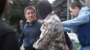 Volodymyr Rybak is seized by masked pro-Russian militants outside Horlivka City Hall building. Photo: open source ~