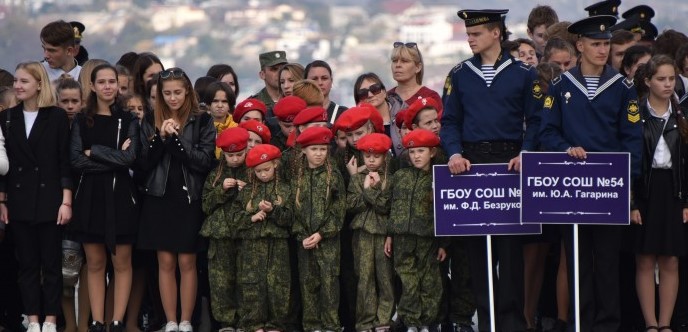 Children in Yunarmia caps and military gear at ceremony in Sevastopol, occupied Crimea. Source: sevzakon.ru ~
