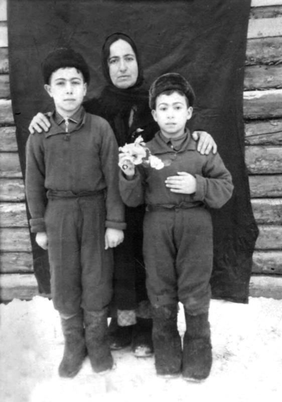 A Crimean Tatar Kataki Hulsum with her children, Ural, 1949. Photo: Ukrainian Institute of National History ~