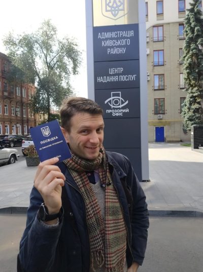 Peter Cribley holds his Ukrainian residency permit. Courtesy photo ~