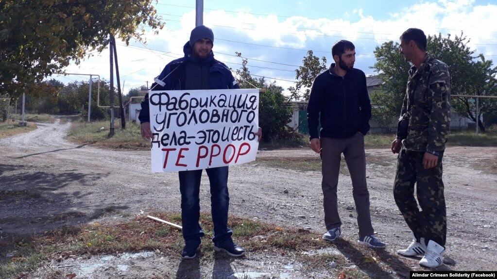 The poster says, “Fabrication of a criminal case is terror itself.” Photo: Crimean Solidarity ~
