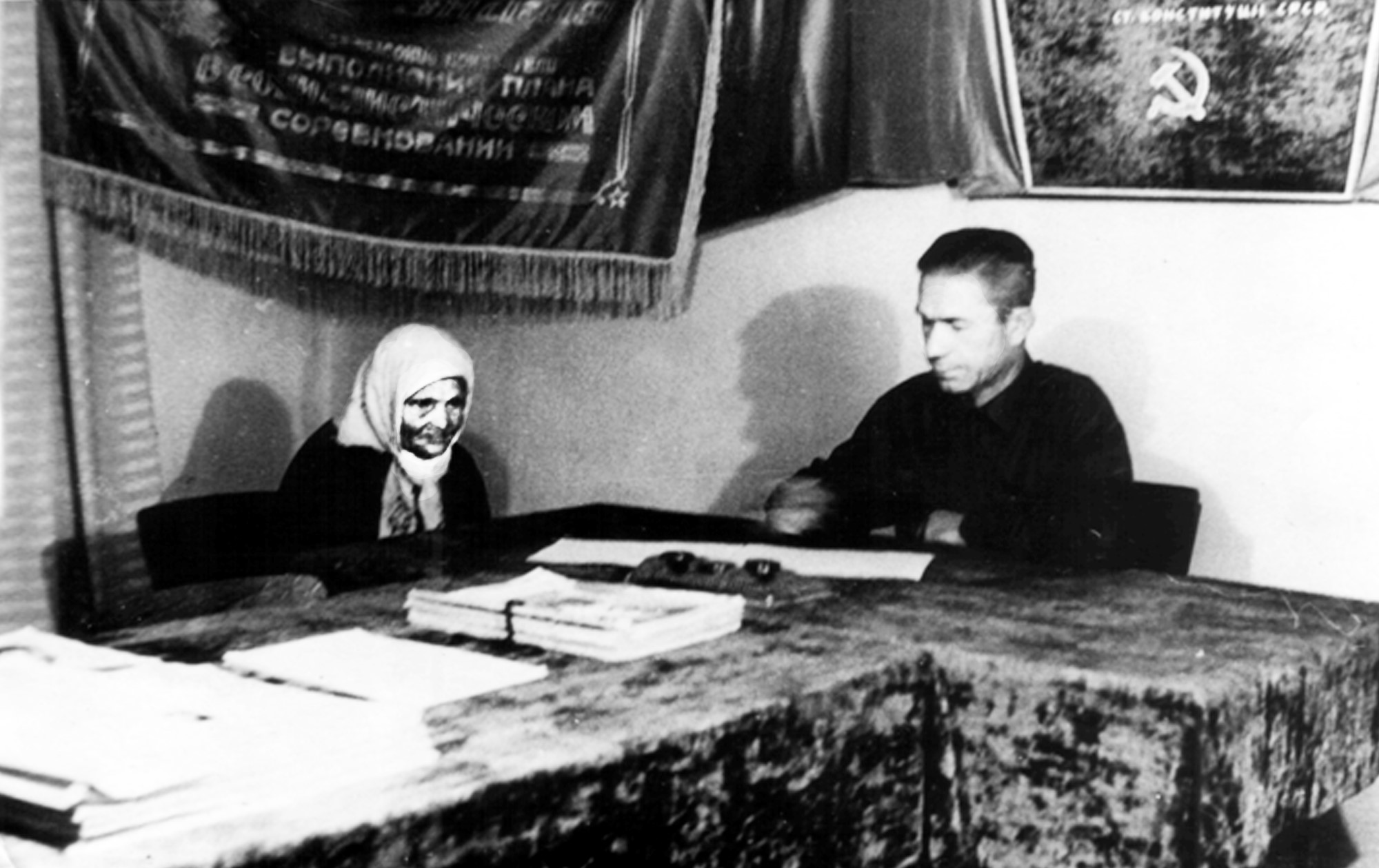A villager signing a "grain procurement contractual agreement" for her family with the Soviet state in the village of Velyka Lepetykha. Such forced "contracts" served as justification to strip Ukrainian farmers of literally all the food they produced, leaving their families to starve. Source: Olena Tsipko Local History Museum of Velyka Lepetykha