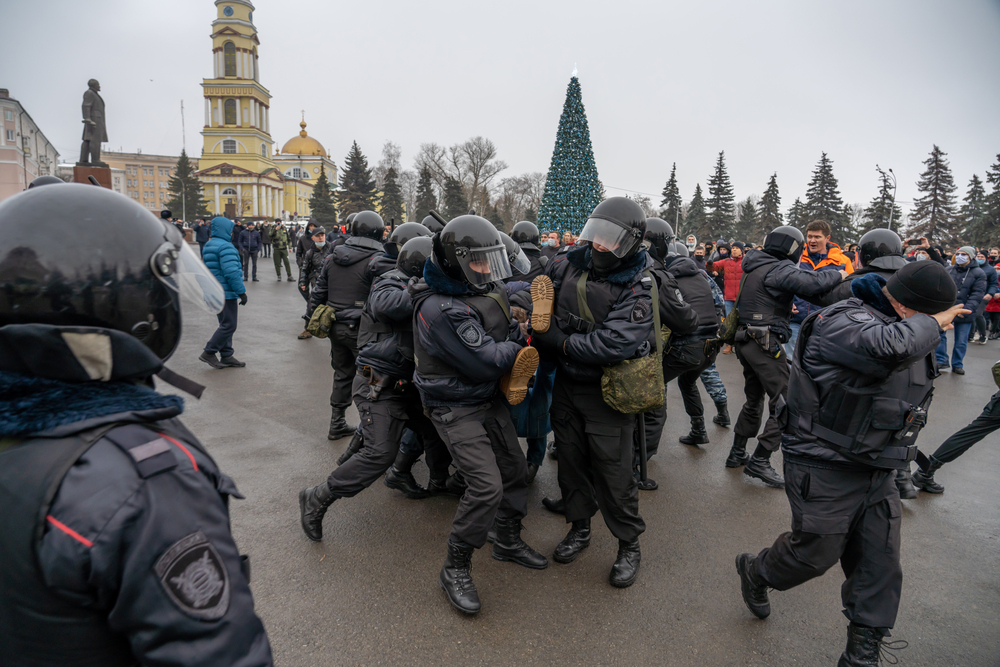 January 23, 2021, Russia, Lipetsk, Rally in support of Alexei Navalny. A man with a poster that says "You can't hide the truth" is harshly detained by the police. Credit: depositphotos