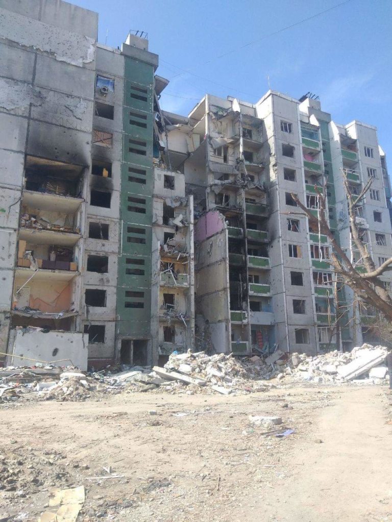 The Russians dropped several high-capacity air bombs on this apartment building and the pharmacy which killed dozens of civilians waiting in line for humanitarian aid. May 2022. (Photo: Anatolii Shara)
