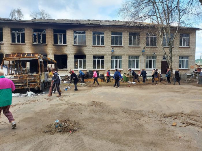 Local residents of Bohdanivka clear up damage from Russian occupation.