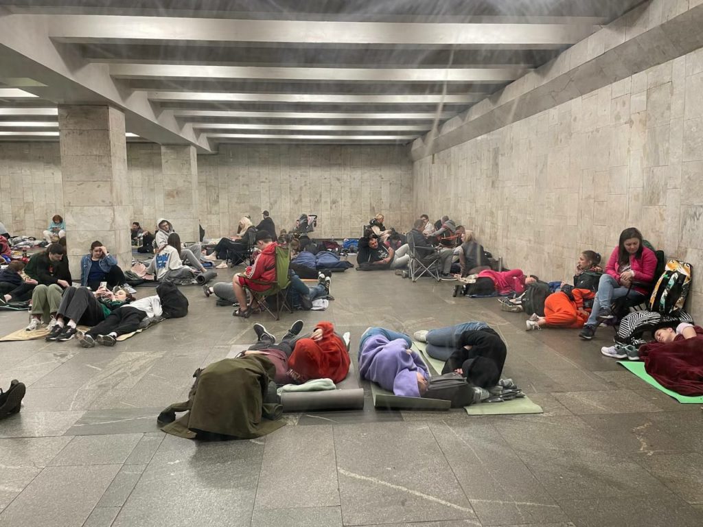 People hide from Russian bombs at a subway station during a nighttime missile and drone attack on Kyiv.