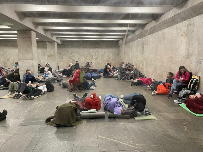 People hide from Russian bombs at a subway station during a nighttime missile and drone attack on Kyiv.