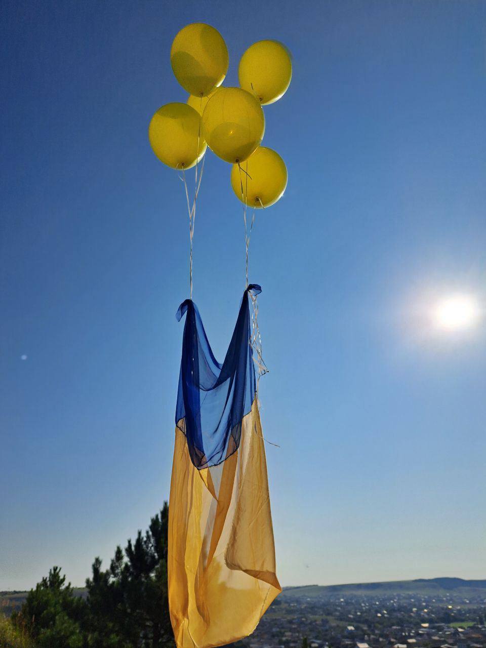 A Ukrainian flag flown on balloons above the Shaan-Kaia mountain near Alupka, occupied Crimea, on 23 August 2023