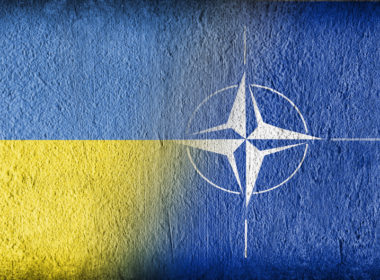 Ukrainian and NATO flag on concrete