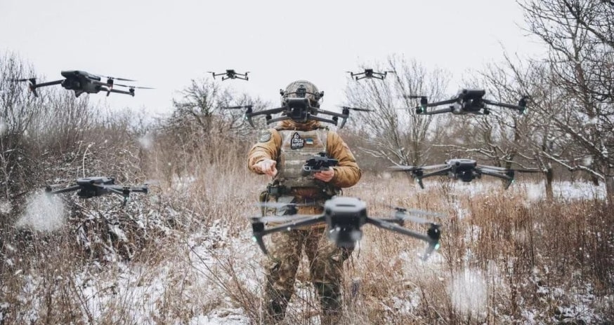 A Ukrainian soldier and drones