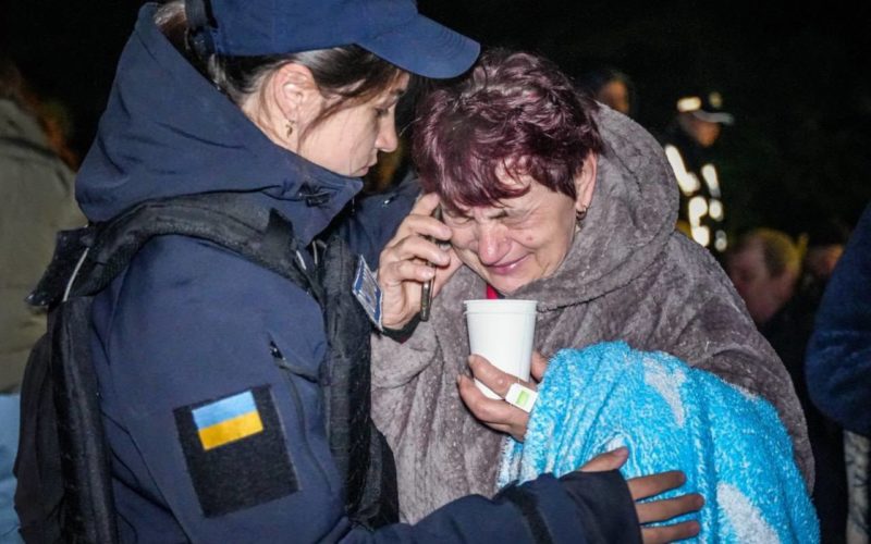 A Ukrainian rescuer is supporting a woman affected by the Russian attack in Odesa oblast