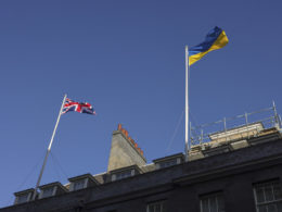 ukrainian flag flies over uk pm's office downing street 25 february 2022 day after russia started its full-scale invasion ukraine / 10 simon dawson solidarity people following russia's