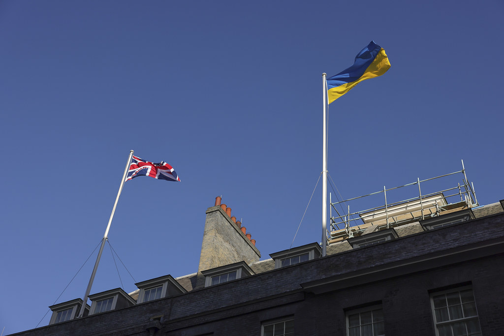 ukrainian flag flies over uk pm's office downing street 25 february 2022 day after russia started its full-scale invasion ukraine / 10 simon dawson solidarity people following russia's