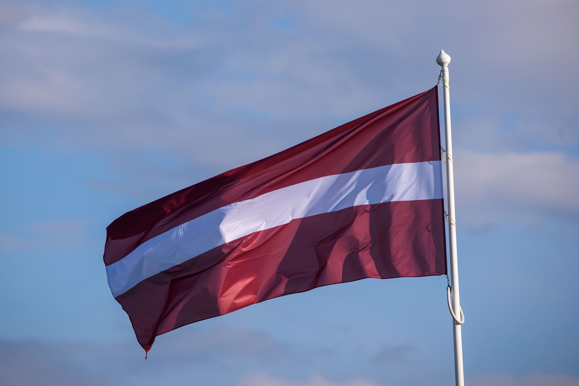 Latvian flag, illustrative image. Photo via Eastnews.ua.