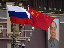 Russian and Chinese national flags are displayed at Tiananmen Gate. Illustrative image. Photo via Eastnews.ua.