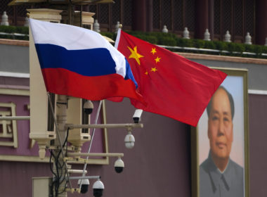 Russian and Chinese national flags are displayed at Tiananmen Gate. Illustrative image. Photo via Eastnews.ua.