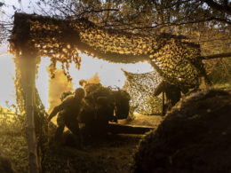 Ukrainian soldier firing artillery, illustrative image. Photo via Eastnews.ua.