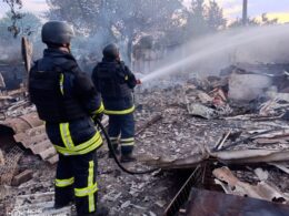 Ukrainian rescuers after the Russian shelling in Kherson Oblast.