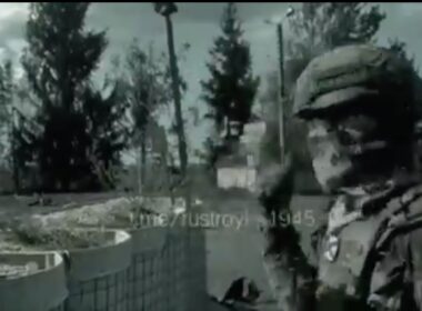 Screenshot from a video of Russians showing a severed head of an alleged Ukrainian soldier