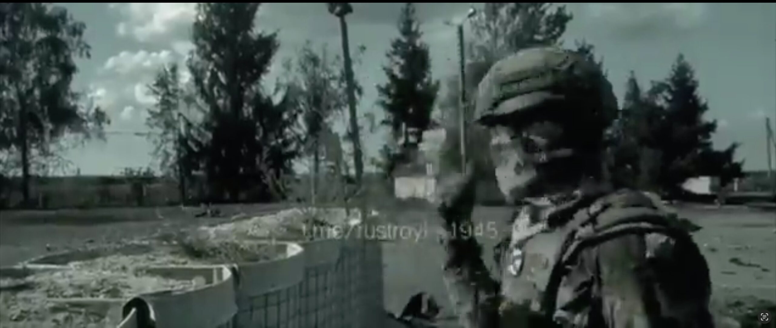 Screenshot from a video of Russians showing a severed head of an alleged Ukrainian soldier