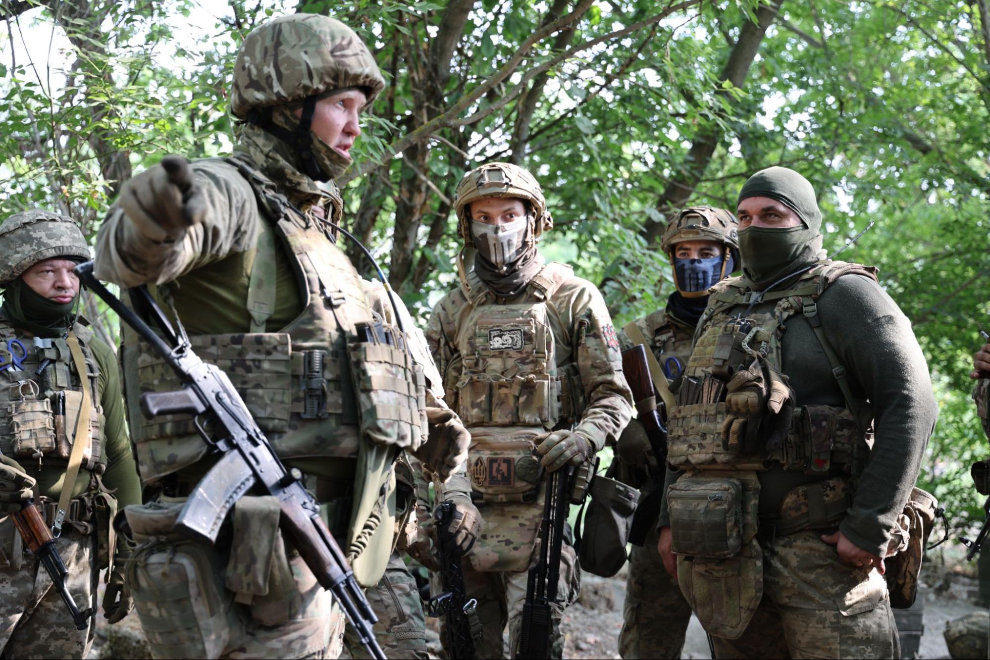 A Colombian soldier guarding a trench in Zaporizhzhia Oblast. Source: David Kirichenko