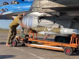 australia donates retired jdam-er precision bombs ukraine ukrainian soldier attaches american gbu-62 under wing air force mig-29