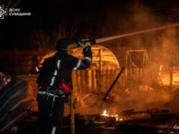 Ukrainian rescuers are extinguishing fire after the Russian drone attack, when falling debris damaged a children's health center in Sumy, 13 January.