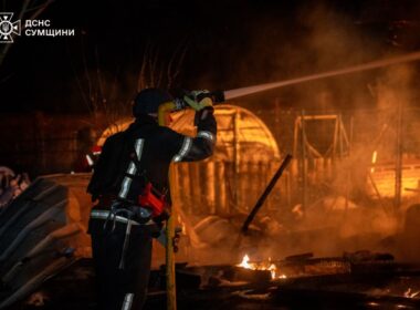 Ukrainian rescuers are extinguishing fire after the Russian drone attack, when falling debris damaged a children's health center in Sumy, 13 January.