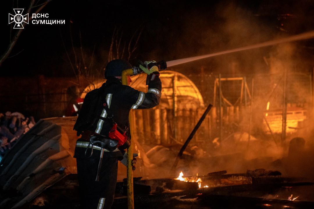 Ukrainian rescuers are extinguishing fire after the Russian drone attack, when falling debris damaged a children's health center in Sumy, 13 January.