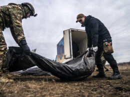 DONETSK OBLAST, UKRAINE - FEBRUARY 24: Volunteers of a group called Black Tulip prepare to examine personal belongings of two Russian soldiers whose bodies were collected on the second anniversary of Russia-Ukraine war in Donetsk Oblast, Ukraine on February 24, 2024.