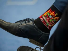 czech diplomat in socks with kremlin burning