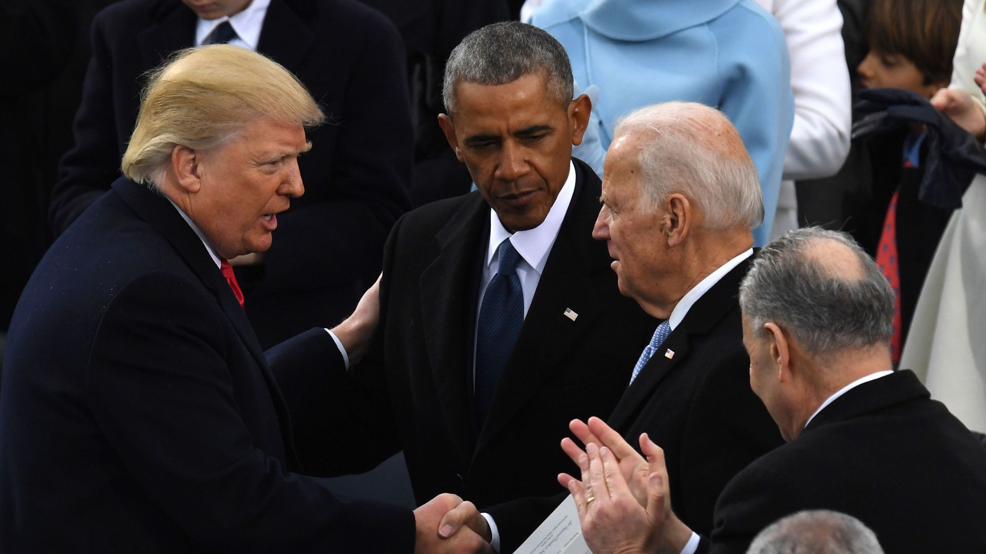 US President Trump greets President Obama and Joe Biden after being sworn in. Photo: Mark Ralston/AFP/Getty Images, via Axios.