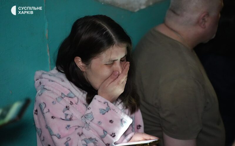 A Ukrainian woman is crying after she survived the Russian attack on her apartment building in Kharkiv on 11 June.