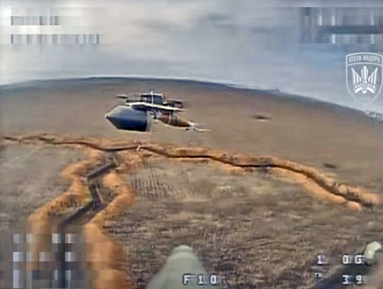 A Russian fiber-optic-guided drone captured on camera by a Ukrainian UAV. January 2025, Ukraine (Source: Ptakhy Madyara unit).