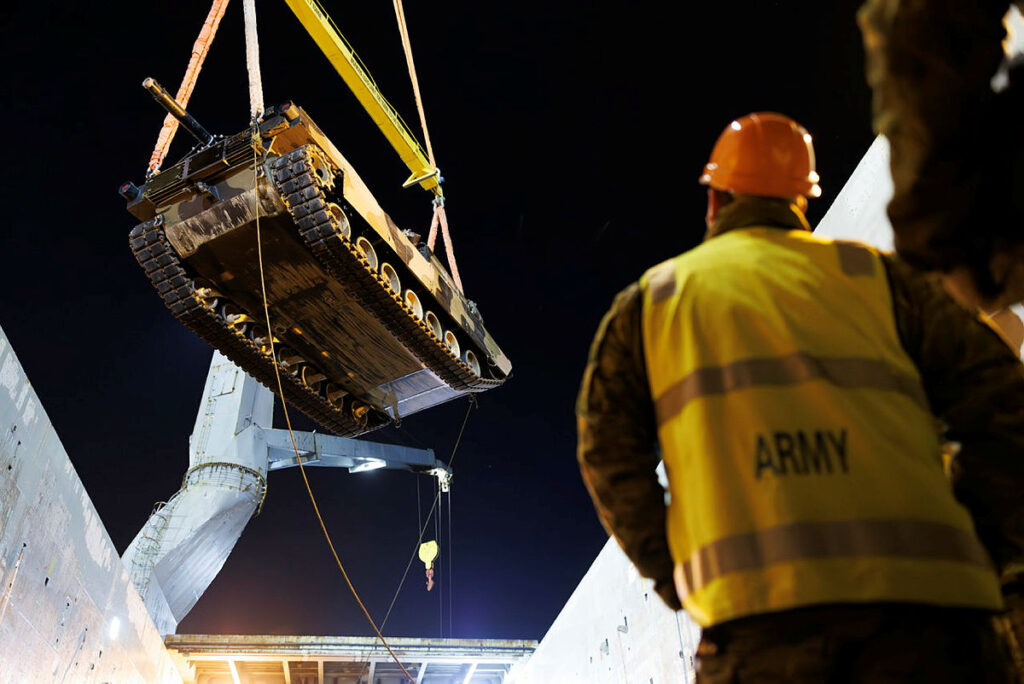 An Australian M-1 being craned onto a ship.