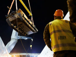 An Australian M-1 being craned onto a ship.